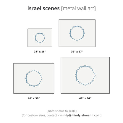 Size chart for metal art prints showing four square canvas options with different dimensions: 24" x 18", 36" x 27", 40" x 30", and 48" x 36". Each print features a blue geometric star design on a light gray background.